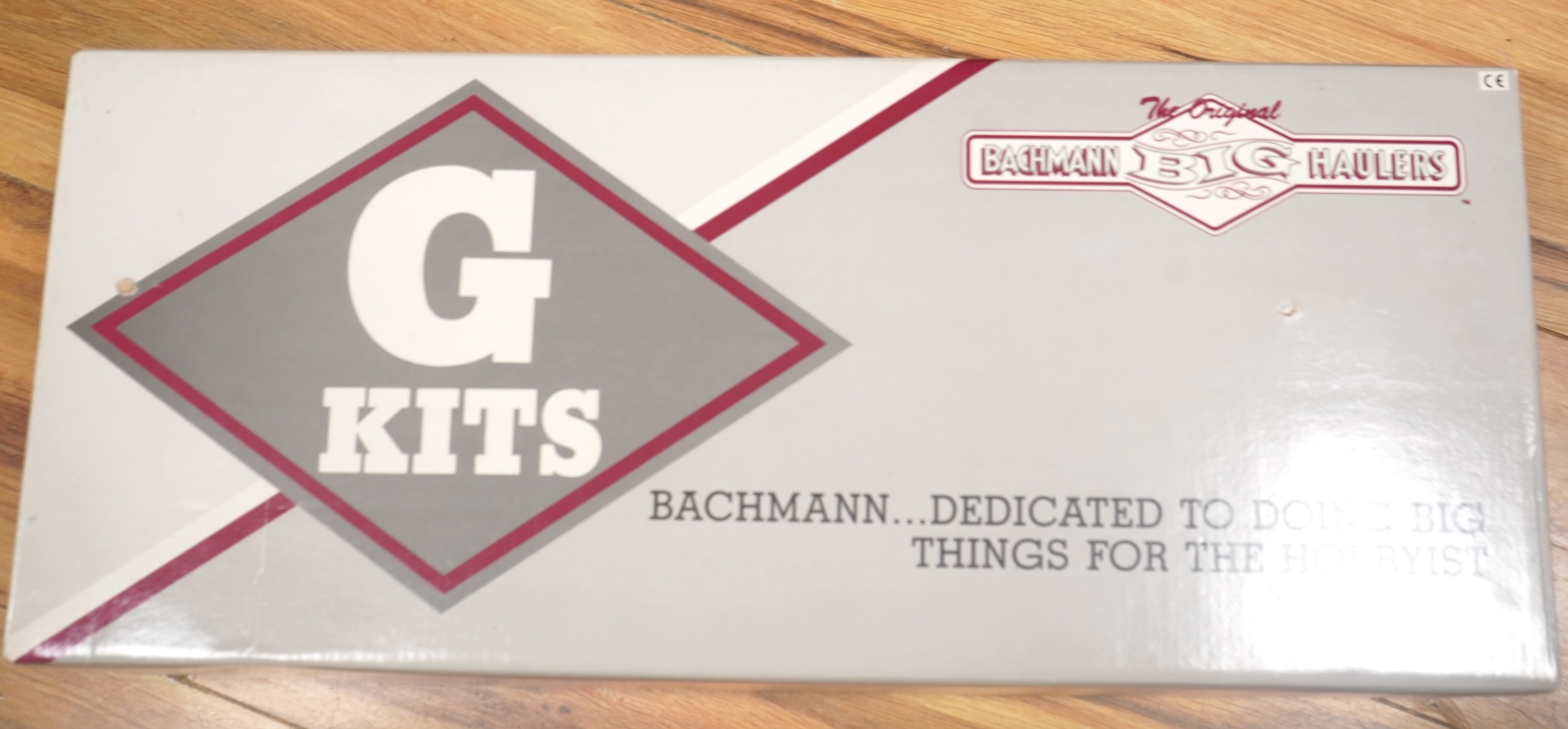 Four Lehmann and Bachmann G scale (45mm gauge) freight wagons; an unconstructed Bachmann Big Haulers G Kits 4-door Baggage Car (98910), an LGB 4-wheel coach in associated box, plus two others by Lehmann Toytrain in assoc